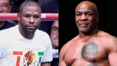 Floyd Mayweather Jr. enters the ring, opposite Mike Tyson at the weigh-in for his fight against Jake Paul