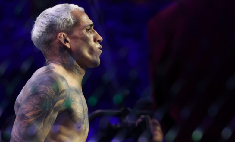 Charles Oliveira enters the Octagon for his fight against Ilia Topuria at UFC 317