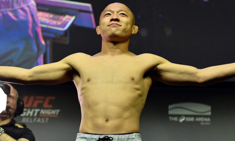 Kyoji Horiguchi poses on the scale during the UFC Belfast ceremonial weigh-in
