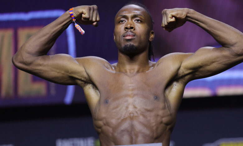 Jalin Turner poses on the scale for his fight against Renato Moicano at UFC 300