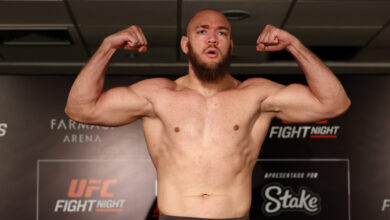Valter Walker poses on the scale at the UFC Rio official weigh-in