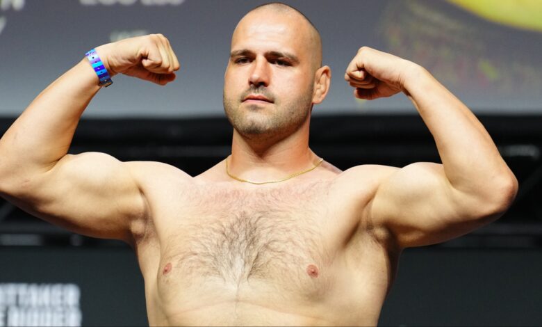 Martin Buday poses on the scale at the UFC Abu Dhabi ceremonial weigh-in