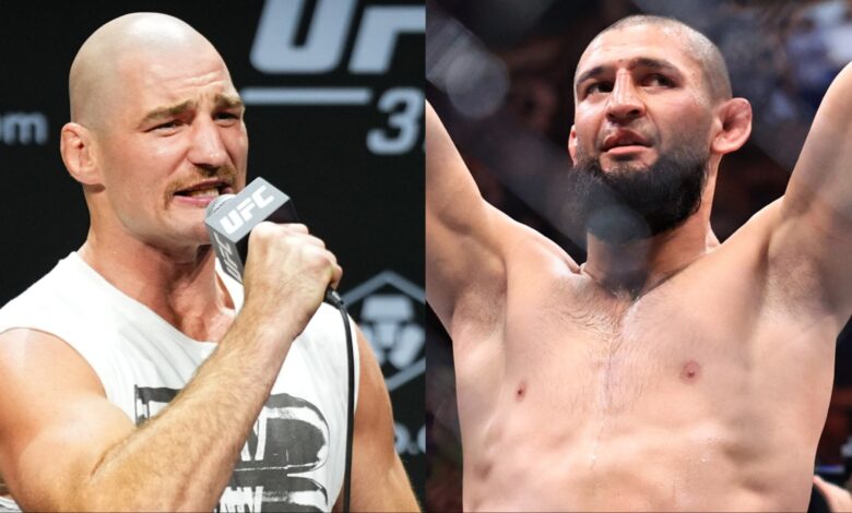 Sean Strickland speaks during the UFC 312 press conference, opposite Khamzat Chimaev celebrating his win at UFC 319