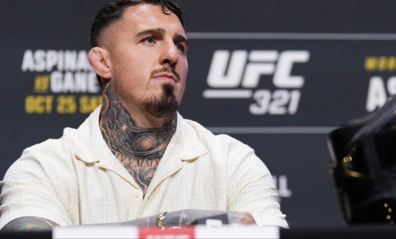 Tom Aspinall appears at a pre-fight press conference for UFC 321