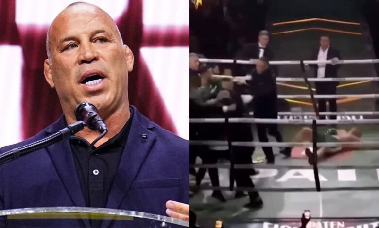 Wanderlei Silva speaks at the UFC Hall of Fame induction ceremony, opposite Silva on the canvas in the boxing ring