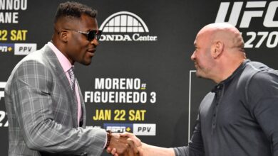 Dana White and Francis Ngannou exchange greetings at the UFC 270 press conference