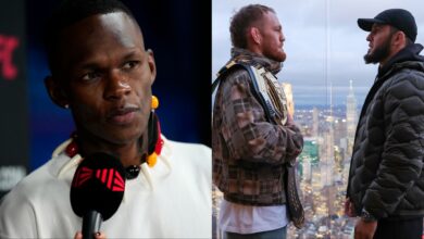 Israel Adesanya is interviewed during UFC 305 media day, opposite Jack Della Maddalena and Islam Makhachev facing off on top of the Empire State Building
