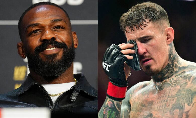 Jon Jones appears at the UFC 309 press conference, opposite Tom Aspinall after an eye poke suffered at UFC 321