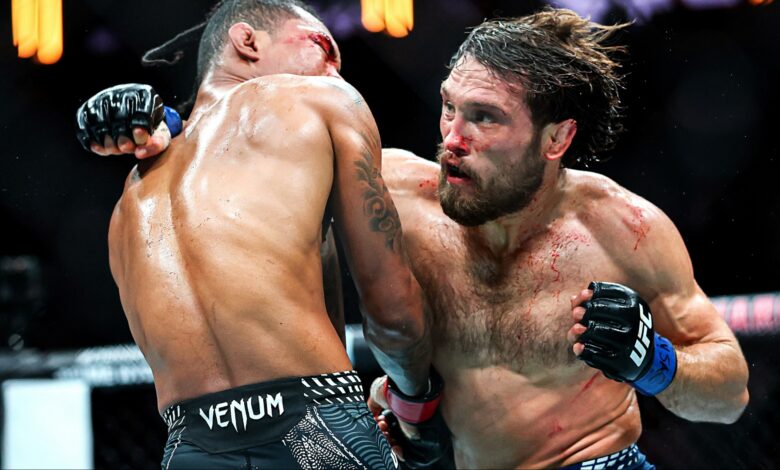 Ethyn Ewing and Malcolm Wellmaker trade punches during their fight at UFC 322