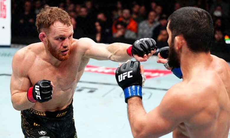 Jack Della Maddalena throws a punch at Islam Makhachev during UFC 322 main event