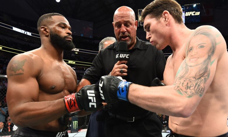 Tyron Woodley and Darren Till touch gloves in the Octagon