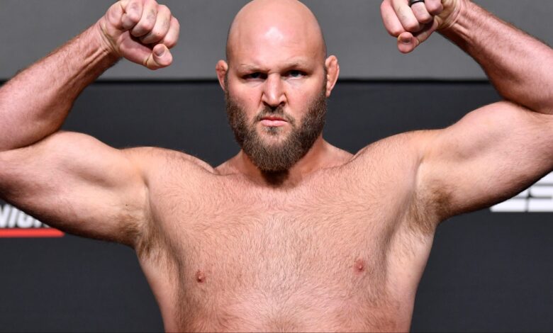 Ben Rothwell poses on the scale during an official UFC weigh-in