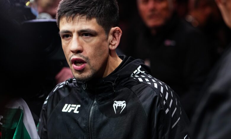 Brandon Moreno walks to the Octagon for his fight at UFC 323