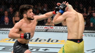 Henry Cejudo throws punch at Marlon Moraes