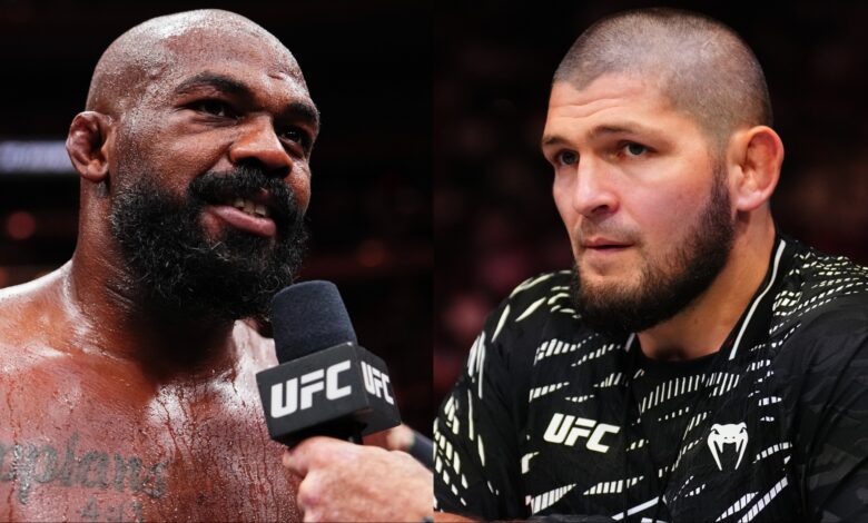 Jon Jones is interviewed after his win at UFC 309, opposite Khabib Nurmagomedov in the corner at UFC 322