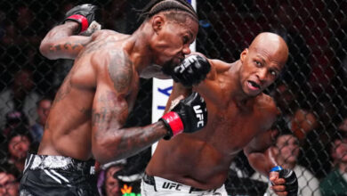 Michael Page punches Kevin Holland