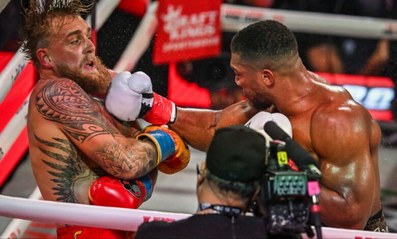 Anthony Joshua punches Jake Paul during their boxing match