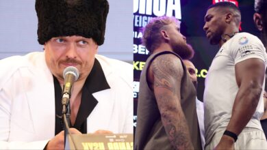 Oleksandr Usyk appears at a press conference, opposite Jake Paul and Anthony Joshua facing off