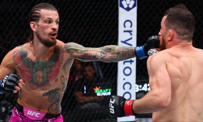 Sean O'Malley punches Merab Dvalishvili during their fight at UFC 316