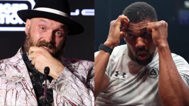 Tyson Fury appears at a press conference, opposite Anthony Joshua at an open workout