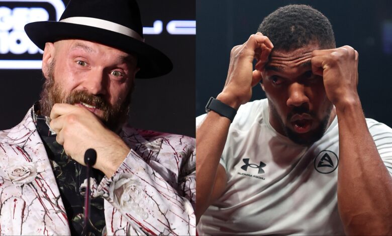 Tyson Fury appears at a press conference, opposite Anthony Joshua at an open workout