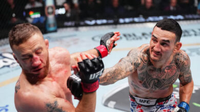 Justin Gaethje punched by Max Holloway at UFC 300