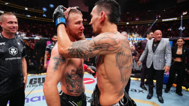 Max Holloway embraces Justin Gaethje at UFC 300