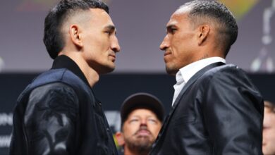 Max Holloway and Charles Oliveira face off at a press conference