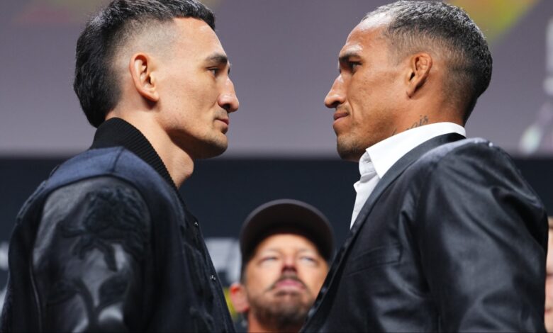 Max Holloway and Charles Oliveira face off at a press conference