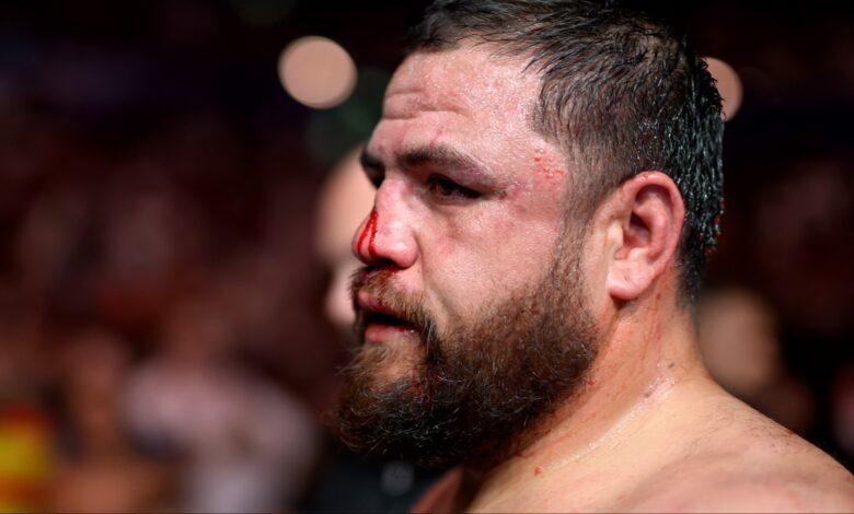 Tai Tuivasa departs the Octagon after a loss at UFC 325